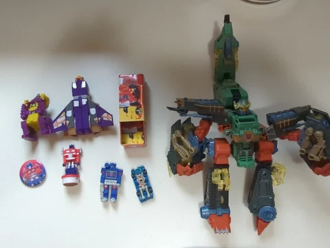 Transformers Assortment Lot  Of 8 -figures, Pin, Stamp, Tin Cover