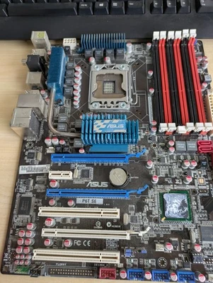 Placa madre Asus P6T SE Intel X58 ATX DDR3 LGA1366 2 x ranuras PCI-E x16 PARA REPUESTOS - Imagen 1 de 2