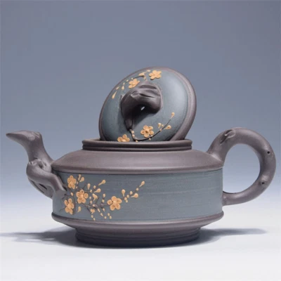 Tetera retro china Yixing de arcilla púrpura hecha a mano con flor de ciruela tetera de kung fu Foto 1 de 4