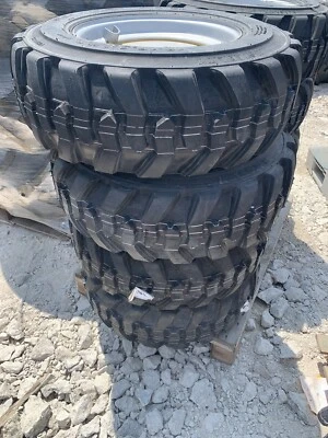 set of 4 10-16.5 tires and rims 10 Ply Manitou Gehl Wacker Neuson Loader - Image 1 of 4