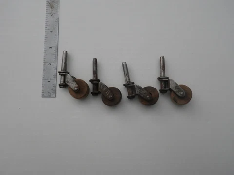 Set of 4 Vintage wood casters for Furniture that swivel with 1 1/4" long stem Cover