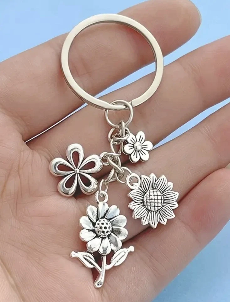 Pretty Keyring With 4 Silvery Flower Charms. Super Gift! BNIB - Image 1 of 3