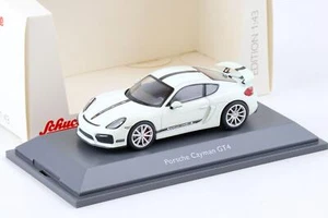 1:43 Schuco Porsche Cayman GT4 cupé rayas blanco/negro - Imagen 1 de 3