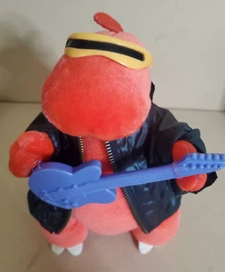 VINTAGE 1986 SPRECHENDES TOP INKL. PLÜSCH ROTER DINOSAURIER MIT LILA GITARRENJACKE & BRILLE - Bild 1 von 4