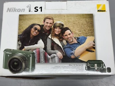 Kit de cámara digital Nikon 1 S1 dos lentes 10,1 MP como nueva en caja verde caqui Foto 1 de 4