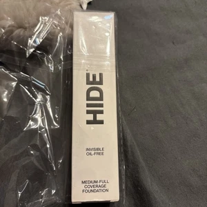 Base de maquillaje HIDE cobertura media completa invisible sin aceite Light Nude 1,0 oz, nueva en caja - Imagen 1 de 5