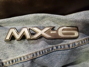 Placa de identificación emblema Mazda MX-6 cromada placa de escritura GA2A 51 720 OEM usada - Imagen 1 de 9