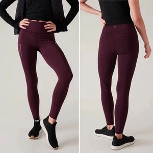 Athleta Rainier Cabernet stretto speziato vita alta tasche zip riflettenti taglia M - Foto 1 di 13