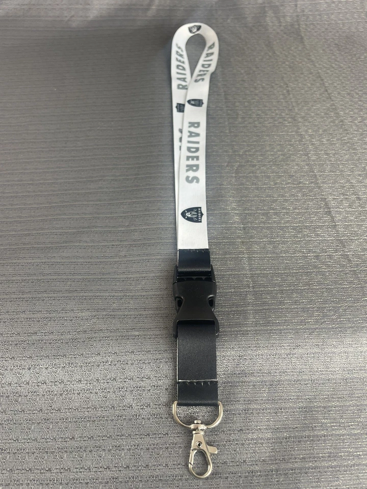 "Cordón Oakland Raiders con llavero desmontable 2 tonos 1"" de ancho" Foto 1 de 4