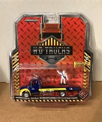 Greenlight HD Trucks S15 International Michelin Flat Bed w/Michelin Man Figure - Image 1 of 4