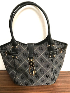 DOONEY AND BOURKE SIGNATURE LOCK, BLACK CANVAS AND LEATHER SHOULDER BAG.
