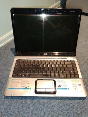 Pantalla HP Pavilion dv2415nr 14.1" AMD Turion 64 X2 sin piezas de batería/reparación como está Foto 1 de 4