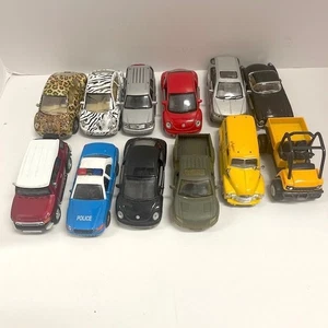 12 Oldtimer bis moderne 4 bis 5 Zoll Druckguss Fahrzeuge 2002-2011 - Bild 1 von 7