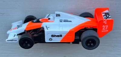 AFX TOMY SUPER-G+ 1990 McLaren HONDA MP4/5B #27 SHELL Ayrton Senna HO Slot Car - image 1 of 4