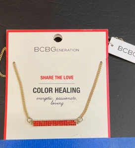 BCBG GENERATION GOLD TONE HEALING REVERSIBILE SHARE THE LOVE NECKLACE RED - Picture 1 of 2