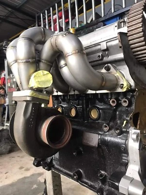 DSM Exhaust Manifold Banana Turbo MITSUBISHI 4G63 4G67 Evo 123 M/VR4 PERFORMANCE - Image 1 of 4