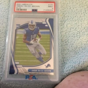 2021 Panini Absolute AMON-RA ST. BROWN Rookie Silver Foil RC #131 Lions Graded 9 - Picture 1 of 3
