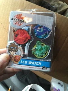 Bakugan Kinder LCD Uhr mit austauschbaren rot/blau/grünen Oberteilen - Bild 1 von 2