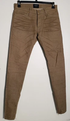 Pantalones de mezclilla ajustados con ribete caqui Fear Of God cremallera tobillos pintura salpicaduras 30X34 Foto 1 de 4