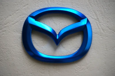Logotipo emblema volante azul para Mazda superpuesto nuevo USPS envío rápido Foto 1 de 3