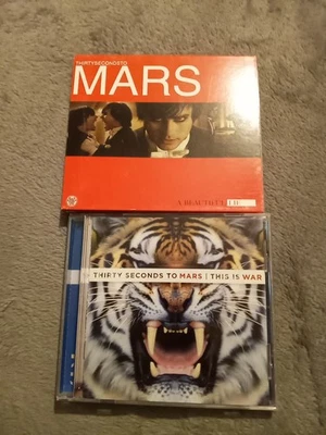 2 Thirty Seconds To Mars Cd Lot. A Beautiful Lie & This Is War - Image 1 of 4