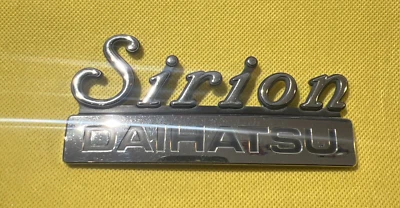 DAIHATSU SIRION - VINTAGE  CAR BADGE / EMBLEM - 124 X 59  MM - Image 1 of 2