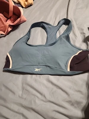 Sutiã esportivo feminino Reebok Speedwick azul preto grande - Imagem 1 de 4