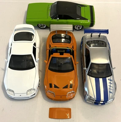 4 JADA 1:24 FAST FURIOUS NISSAN GT R R34 SUPRA ORANGE WHAT GREEN CHARGER DIECAST - Image 1 of 4