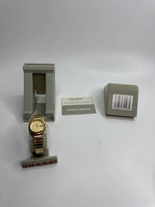 Vintage Sharp Gold Toned Mens Stretch Metal Band Calendar Watch Water Resistant - Picture 1 of 8