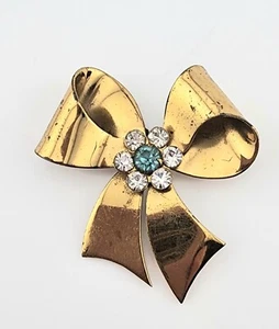 Spilla fiocco nastro strass tono oro Coro vintage - Foto 1 di 6