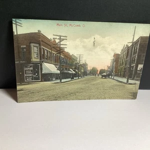 ANTIQUE POSTCARD MAIN ST McCOMB OHIO BRICK STREET SIGNS HORSE BUGGY PEOPLE - Picture 1 of 9