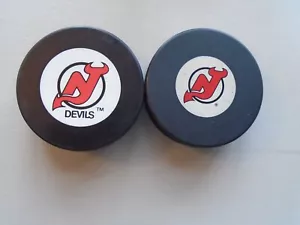 New Jersey Devils Pucks - Picture 1 of 3