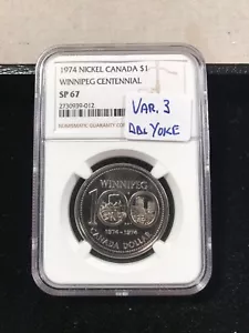 Dólar canadiense 1974 espécimen NGC 67 doble yugo variedad 3 - Imagen 1 de 4