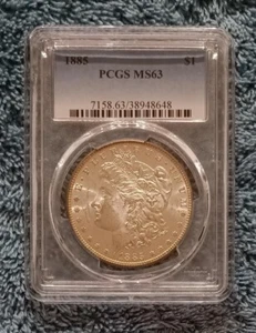 1885 Morgan Dollar, PCGS MS63, brillant, halbproof, mit goldenem Toning - Bild 1 von 6