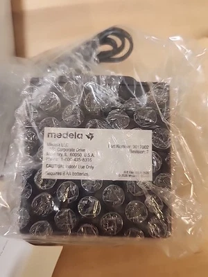Paquete de baterías Medela 9017002 adaptador de corriente 9 voltios para bomba estilo 57000 y 55000 Foto 1 de 3