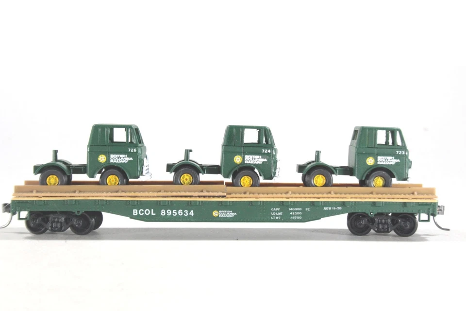 HO Tyco Cust BC Rail 50ft Flat Car BC Rail Semi-Tractors Athearn Trucks KD Cplrs - Image 1 of 4