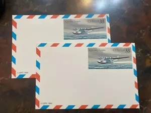 TWO 1985 US #UXC22 AIR MAIL 33c POSTAL CARD CHINA CLIPPER SEAPLANE MINT - Picture 1 of 3