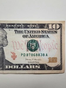 10 $ Schein 2017A, Fancy Serial PD87868838A - Tintenanschnitt auf Rückseite "PUPPE" - Bild 1 von 7