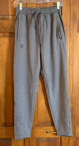 Pantalon conique gris homme Under Armour avec poches zippées étiquette taille M - Photo 1/5