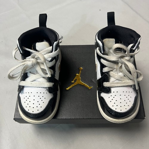Scarpe sneakers Jordan 1 Mid SE (TD) nero oro swoosh bianco bambino taglia 6C