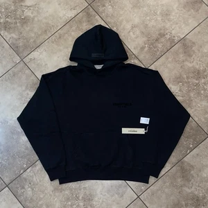 Fear of God Essentials Pullover Brust Logo Hoodie Stretch Limo/Schwarz Small - Bild 1 von 9