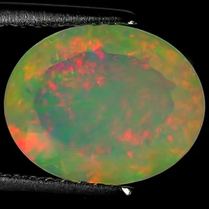 1.58 Ct Natural Ethiopian Faceted Opal Gemstone Multi Color Oval Cut - Picture 1 of 2