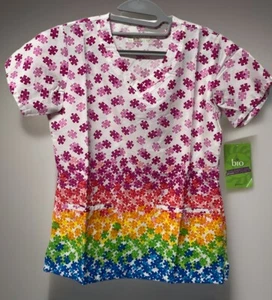 Jockey Scrub Top XS NWT Puzzle Pieces Multicolor Rainbow Nurse Medical Uniform - Picture 1 of 6