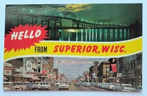 Superior WI Wisconsin Tower Ave Night View of Hi Bridge Shops Hotels Postcard D7 - Picture 1 of 2