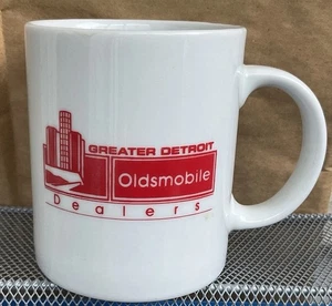 Taza de café vintage concesionario de automóviles DRUMMY OLDSMOBILE - DETROIT Skyline - Imagen 1 de 5