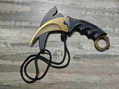Karambit Fixed Blade Knife (Black Handle, Gold W/ DESIGN Steel Blade)  7” - Image 1 of 4