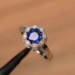 2Ct Round Cut Lab Created Blue Sapphire Halo Women Ring White Gold Plated Silver