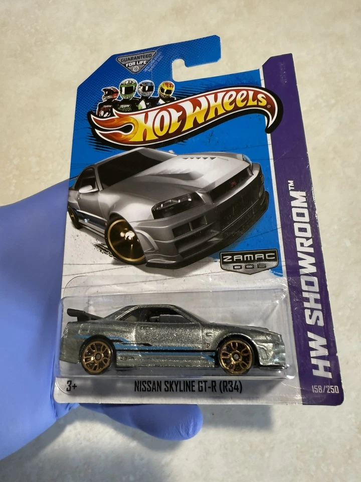 Hot Wheels 2013 HW Showroom Nissan Skyline GT-R R34 in Zamac - Gold J5's MOC!🔥 - Image 1 of 3