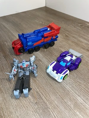 Lote Transformers - Playskool Heroes Rescue Bots Blurr, Earthspark y Optimus Foto 1 de 4