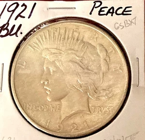 1921 PEACE SILVER DOLLAR UNCIRCULATED TYPICAL WEAK STRIKE - Picture 1 of 2